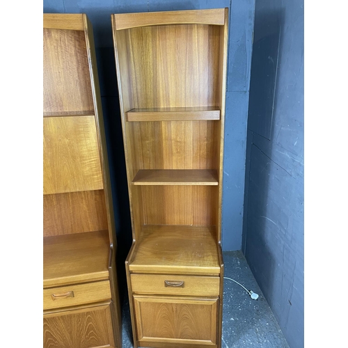 27 - A pair of large teak lounge units by William Lawrence furniture