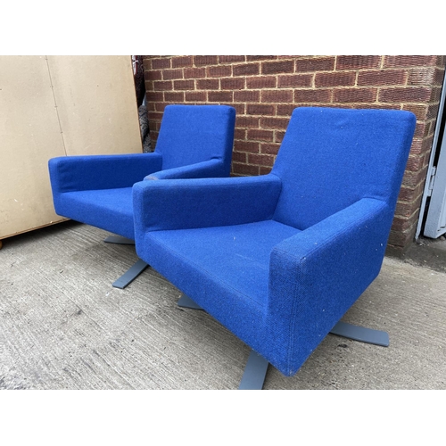 275 - A pair of modern blue designer office swivel chairs