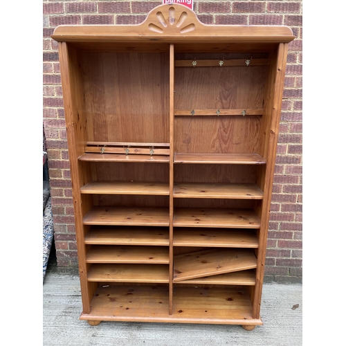 279 - A tall pine open fronted bookcase with adjustable shelves