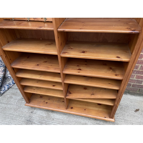 279 - A tall pine open fronted bookcase with adjustable shelves