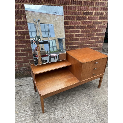 285 - A mid century teak three drawer dressing tabke