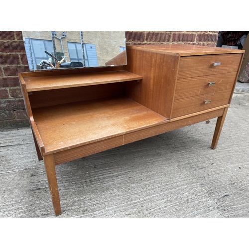 285 - A mid century teak three drawer dressing tabke