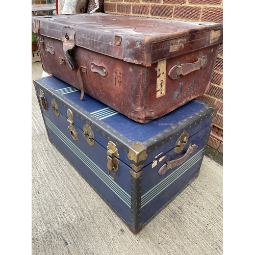 289 - Two large vintage traveling trunks