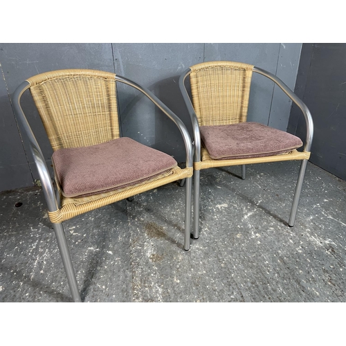 29 - A pair of aluminium cafe style stacking chairs
