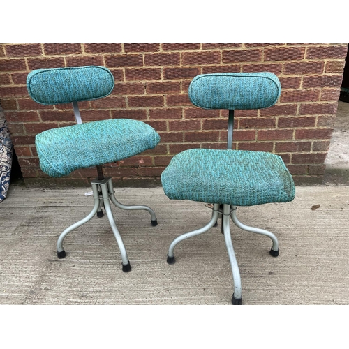 299 - A pair of 20th century typists chairs