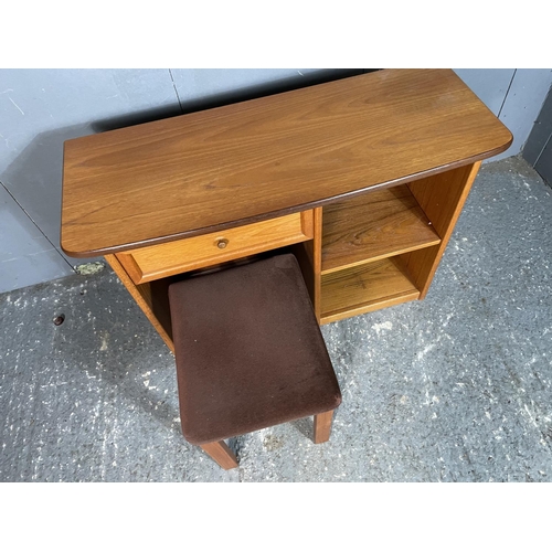 30 - A mid century teak kneehole dressing table / desk together with stool 108x42x70