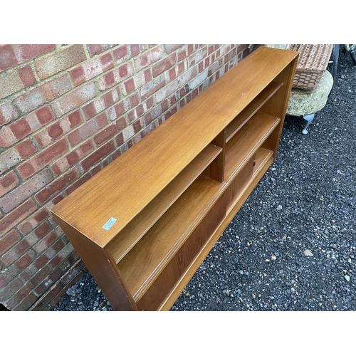 314 - A mid century light oak bookcase by Gibbs