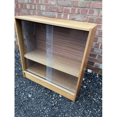 327 - A glazed teak two door bookcase