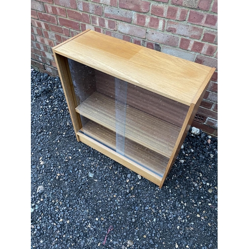 327 - A glazed teak two door bookcase