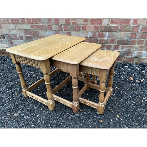 333 - A light oak nest of three tables