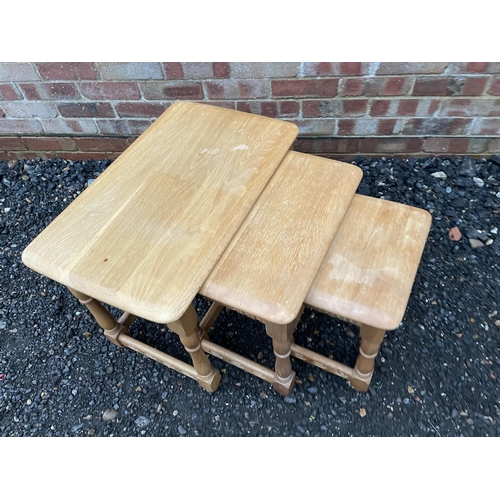 333 - A light oak nest of three tables