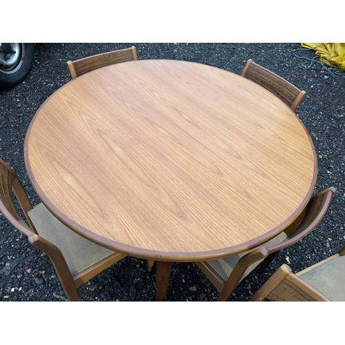 338 - An extending circular g Plan teak table together with a set of 6 mid century chairs