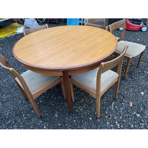 338 - An extending circular g Plan teak table together with a set of 6 mid century chairs