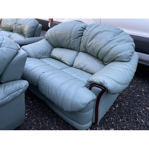 339 - A set of three green leather sofas, two of which have reclining seats and footrests