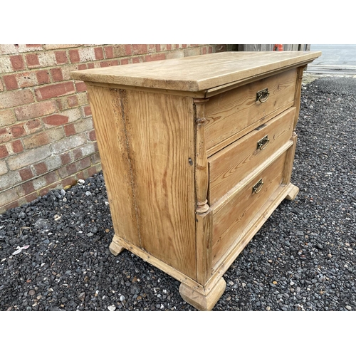 342 - A continental pine chest of three drawers