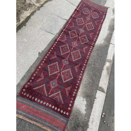 346 - A red and blue oriental runner rug 262x63