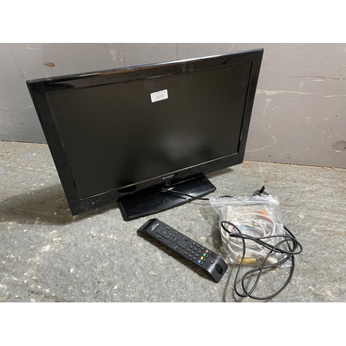 35 - A sharp Tv with remote