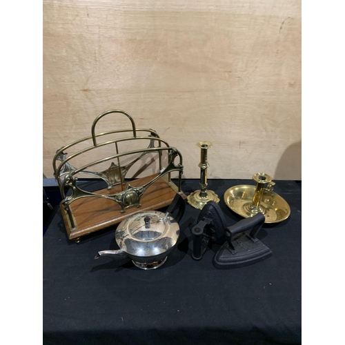 484 - Brass magazine rack, two brass candlesticks, Edward Hall teapot and two flat irons