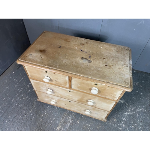 55 - An antique pine chest of four drawers with white ceramic knobs 86 x 45 x 70