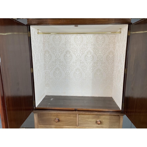 57 - A mahogany linen press, upper hanging section lined with white damask upon two over two drawers 122 ... 