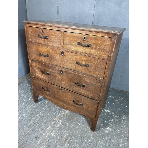 58 - An oak chest of five drawers