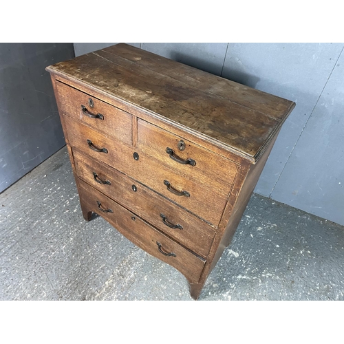 58 - An oak chest of five drawers
