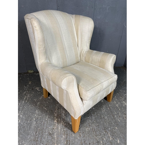 69 - A cream striped upholstered armchair by Multiyork