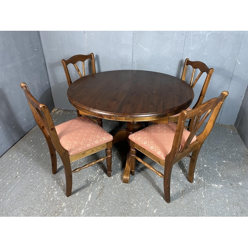 7 - A ducal pine circular extending table together with four chairs diameter 112cm