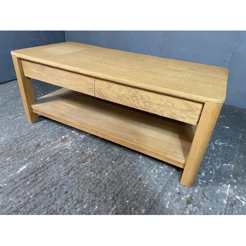 78 - A light oak two drawer coffee table