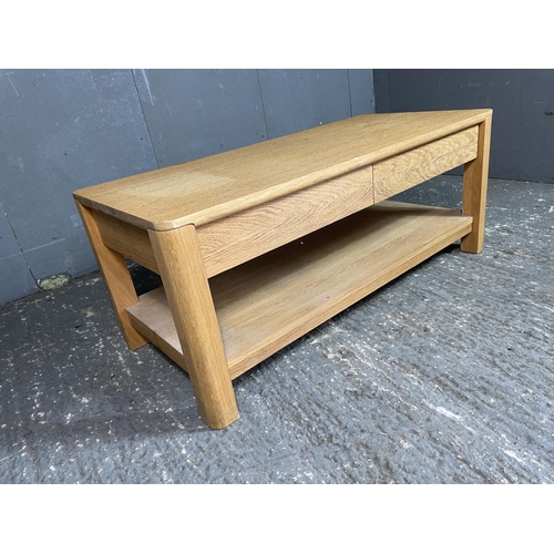 78 - A light oak two drawer coffee table