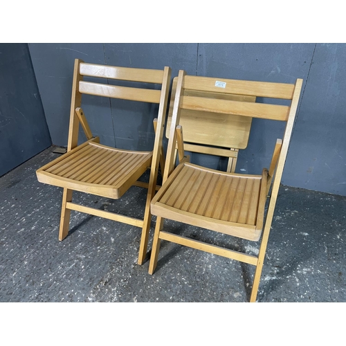 79 - Two folding chairs and a folding table