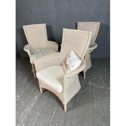 85 - Three white wicker conservatory chairs