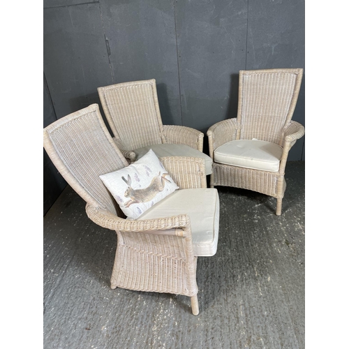 85 - Three white wicker conservatory chairs