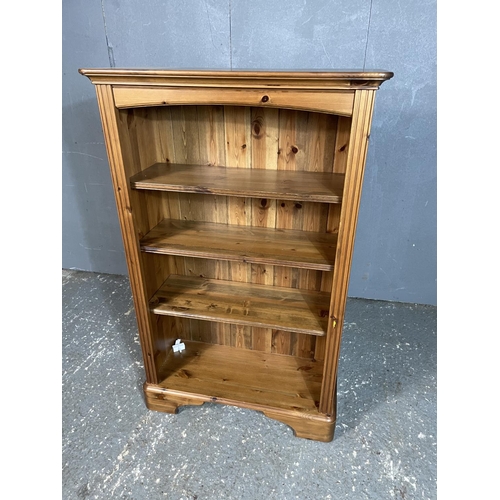 9 - A solid pine open fronted bookcase with adjustable shelves 76x33x120