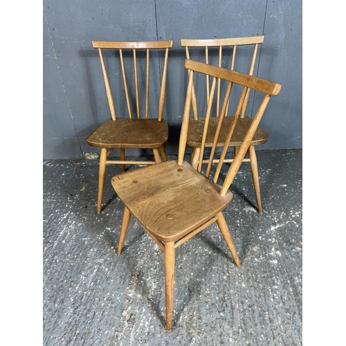 91 - A set of three Ercol stick back chairs