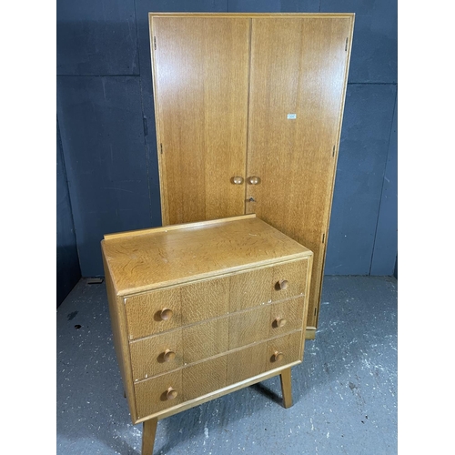 96 - A  mid century light oak bedroom pair by meredew consisting of a wardrobe together with a chest of t... 