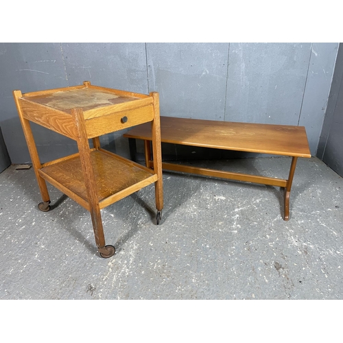 99 - A teak coffee table together with a light oak trolley