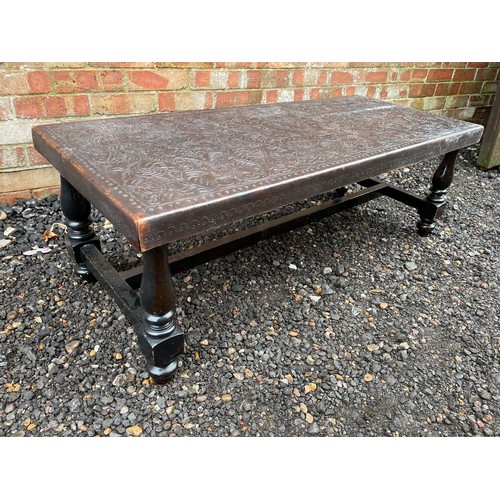 253 - An African style leather top coffee table