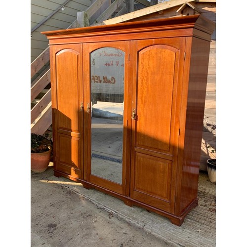 191 - an Edwardian mahogany triple Compactum wardrobe