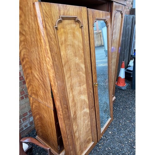 202 - A large Victorian mahogany triple Compactum wardrobe fitted with four slides and four drawers 174x58... 