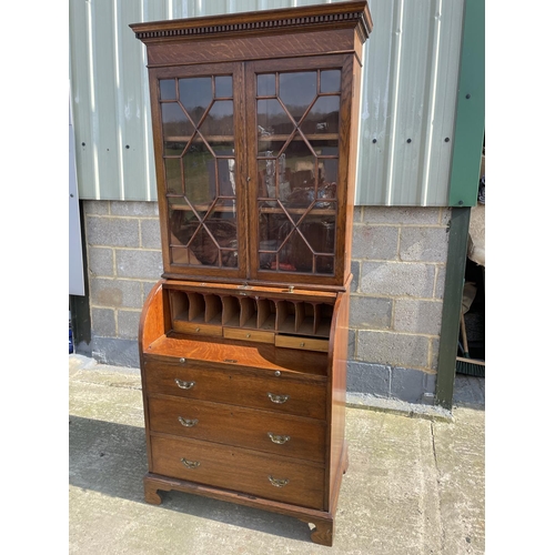 12 - A Victorian oak cylinder bureau bookcase, fitted with stationary rack interior 83x50x205