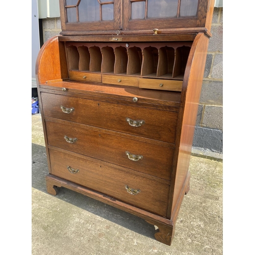 12 - A Victorian oak cylinder bureau bookcase, fitted with stationary rack interior 83x50x205