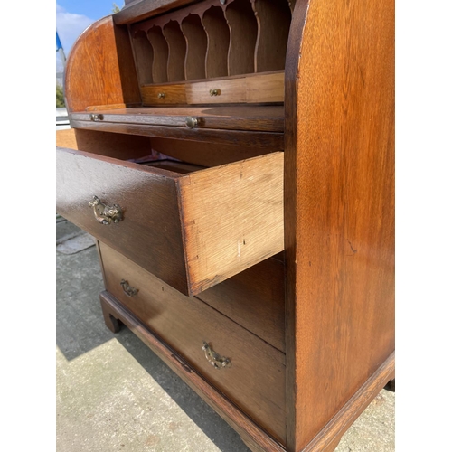 12 - A Victorian oak cylinder bureau bookcase, fitted with stationary rack interior 83x50x205