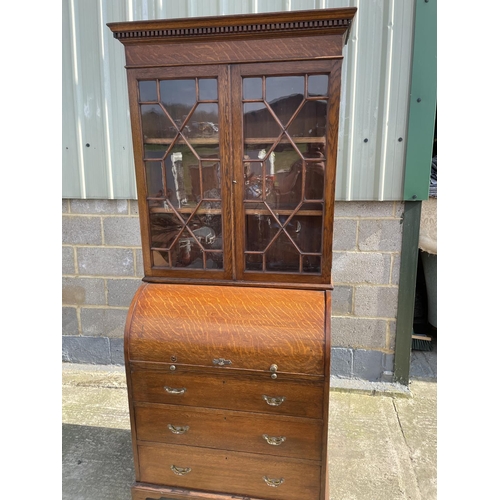 12 - A Victorian oak cylinder bureau bookcase, fitted with stationary rack interior 83x50x205