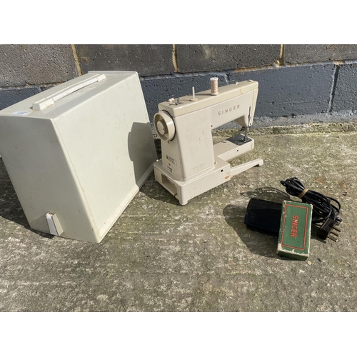 26 - A cased singer sewing machine