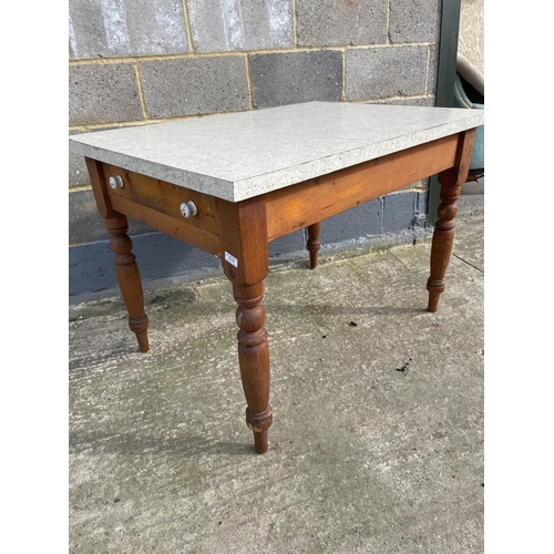 34 - A single drawer pine kitchen table fitted with a Formica top 75x110