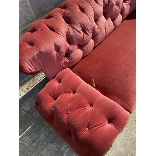 8 - An Edwardian pink buttoned back chesterfield sofa 185cm wide