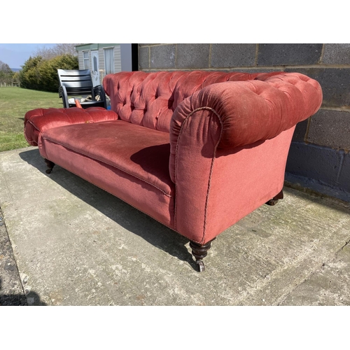 8 - An Edwardian pink buttoned back chesterfield sofa 185cm wide