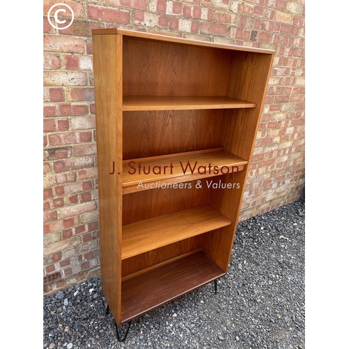 11 - A g Plan mid century open fronted  bookcase raised on hairpin legs