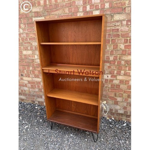 11 - A g Plan mid century open fronted  bookcase raised on hairpin legs